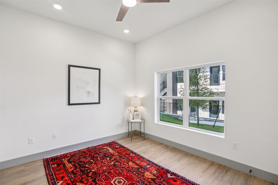 Empty room with recessed lighting, ceiling fan, and wood finished floors