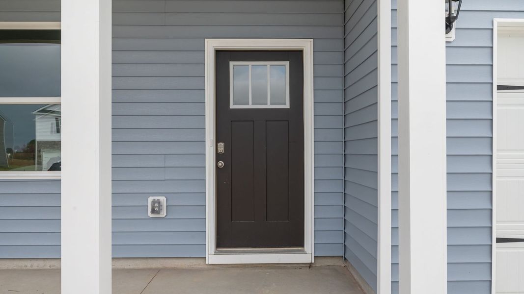 Exterior details and patio area of a home in East Ridge, Ayden (Image 4).