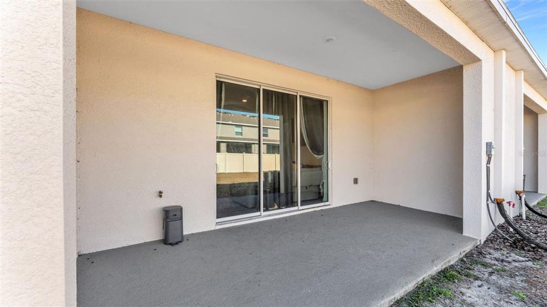 Exterior details and patio area of a home in Farm at Varrea, Plant City (Image 25).