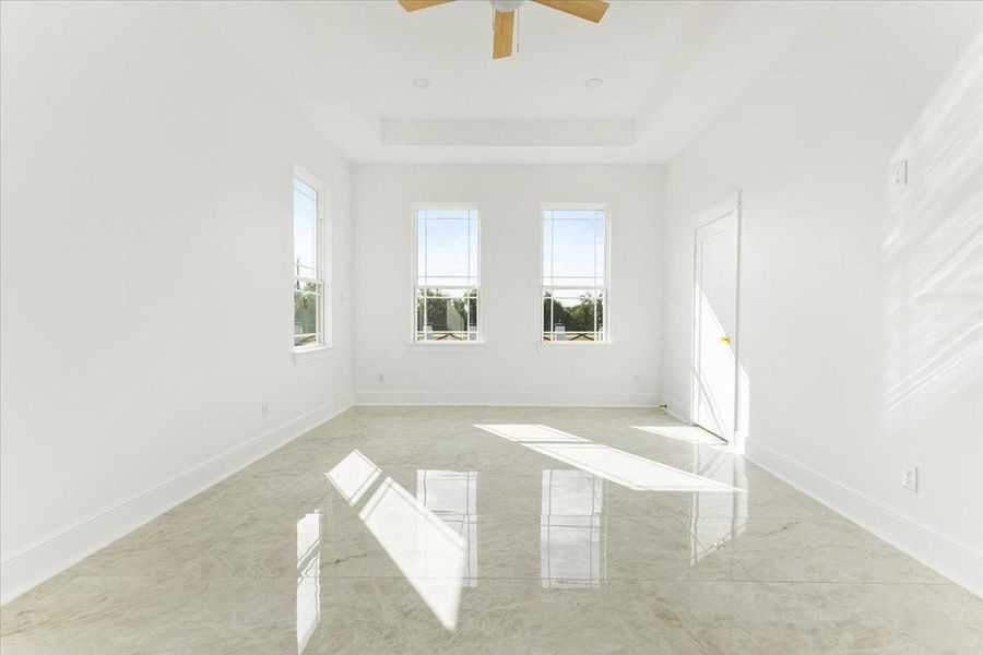 Alternative view of the primary bedroom showcasing the spacious layout and bright interior. Alternative view of the primary bedroom showcasing the spacious layout and bright interior.