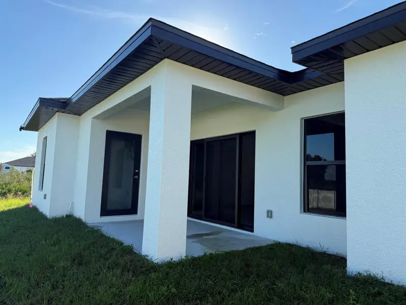 Exterior details and patio area of a home in , Lehigh Acres (Image 2).