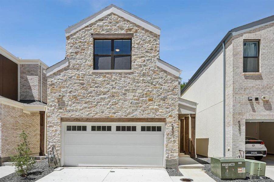 View of front of property with a garage