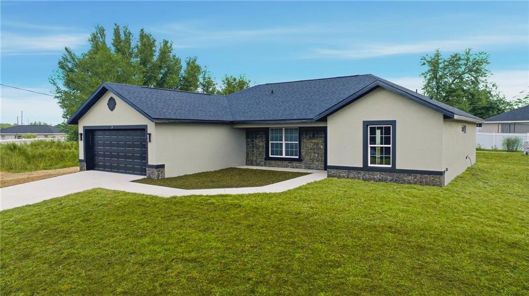 Front exterior of a new home in , Ocala, FL, highlighting curb appeal (Image 1).