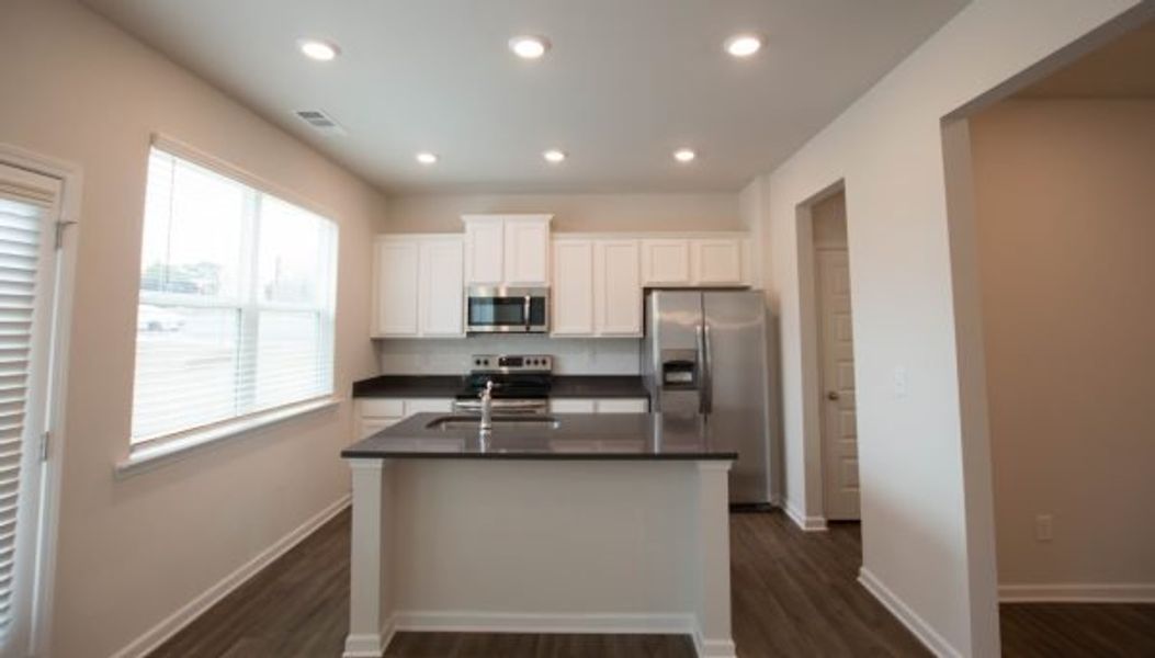 Representative furnished interior of a home built from the Turner by Piedmont Residential in Owen Preserve, Canton (Image 3).