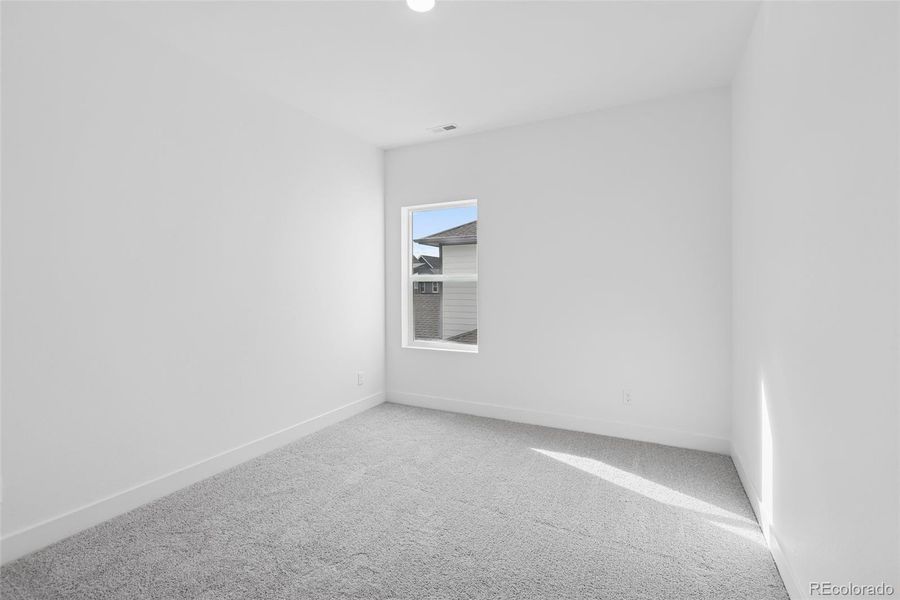 Spacious, unfurnished interior of a new home in Painted Prairie Cottage, Aurora (Image 28).