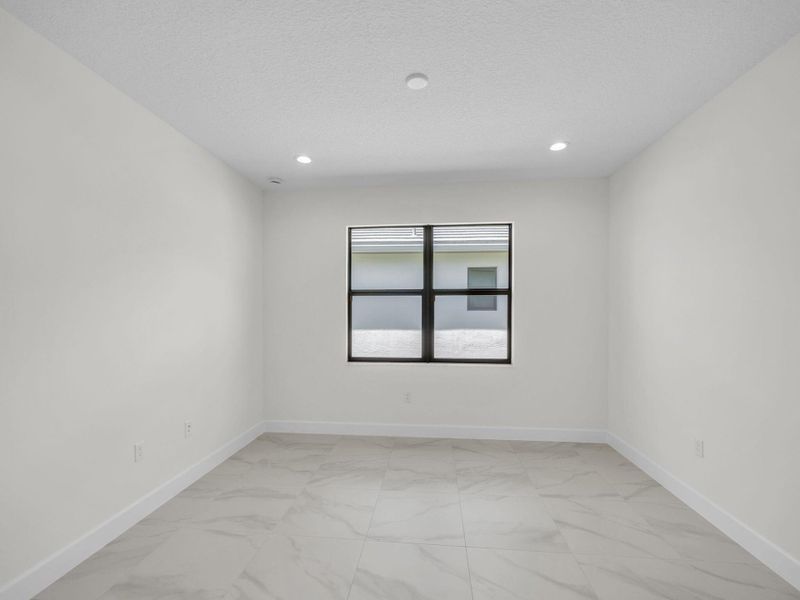 Spacious, unfurnished interior of a new home in Valencia Parc at Riverland, Port St. Lucie (Image 15).