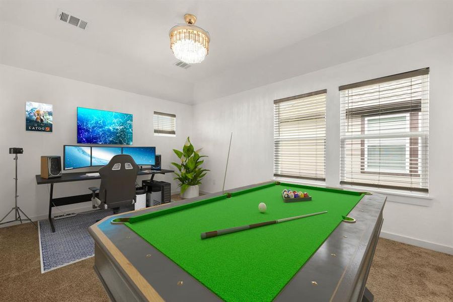 Perfect for entertaining is this amazing game room!  Right upstairs this space would be a fabulous teen hangout, media room, or adult game room complete with pool table and big screen TVs. Featuring plush carpet, high ceilings, custom lighting, and large windows with privacy blinds.