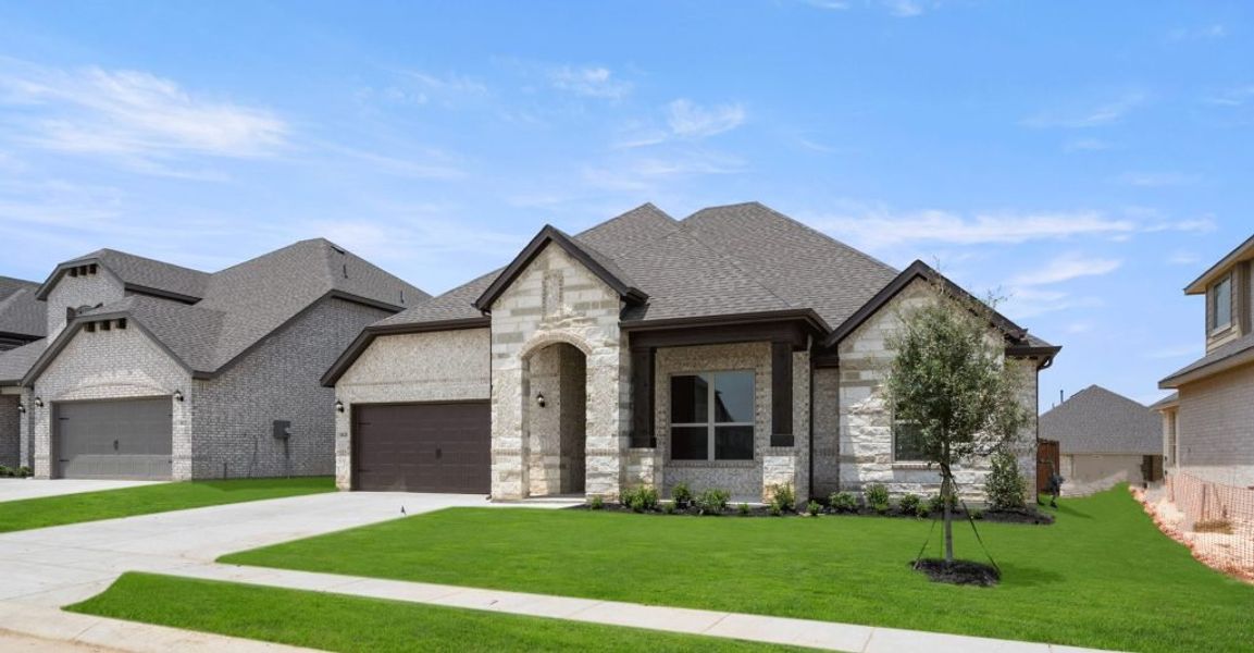 Representative exterior photo of a completed home built from the Donnington by Impression Homes in Still Water Lake, Godley, TX (Image 2).
