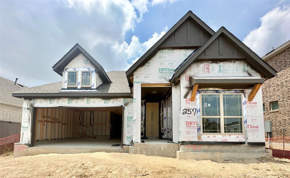 Unfinished property with roof with shingles and board and batten siding Unfinished property with roof with shingles and board and batten siding