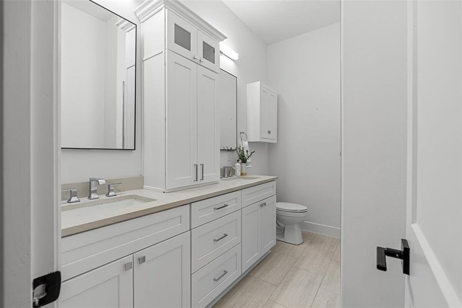 Bathroom with vanity and toilet