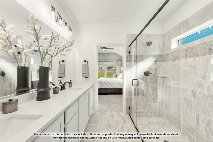Master bathroom with double vanity, glass walk-in shower with marble tile, and view into bedroom Master bathroom with double vanity, glass walk-in shower with marble tile, and view into bedroom
