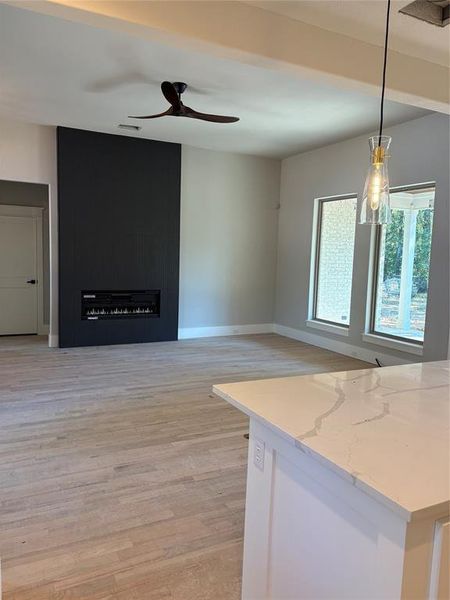 Kitchen to Den with fireplace