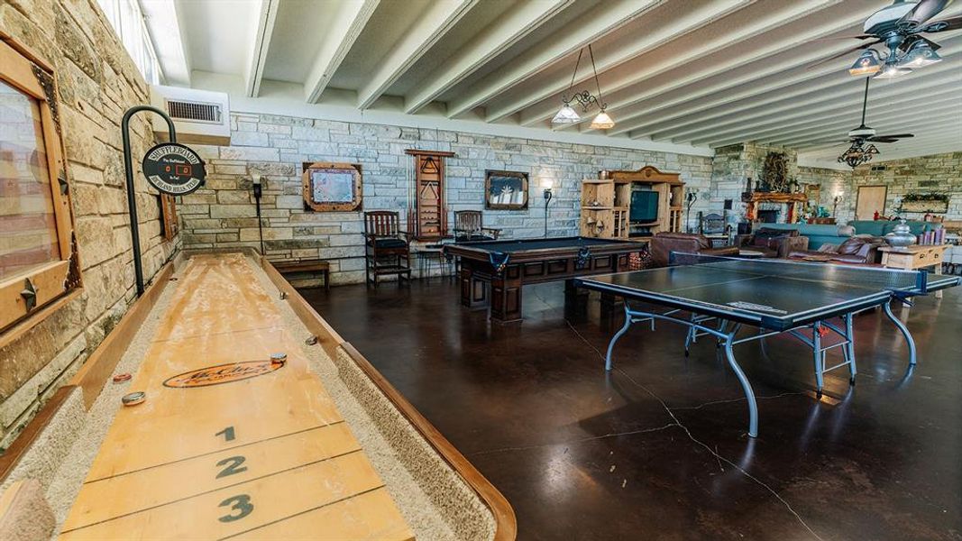 Recreation room featuring beam ceiling, a ceiling fan, and billiards table