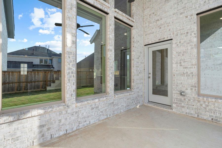 Exterior details and patio area of a home in Dunham Pointe 50', Cypress (Image 21).