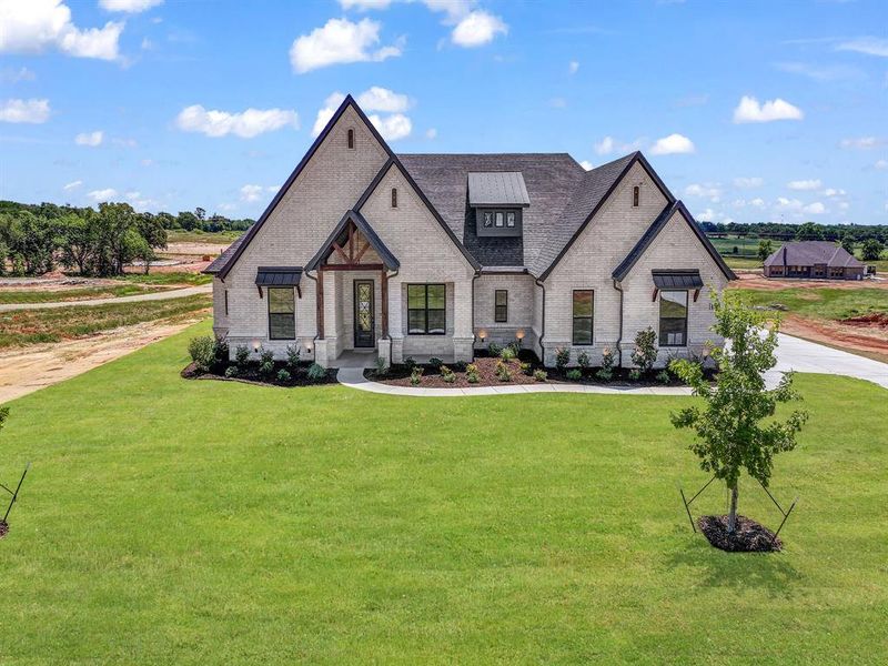 Front exterior of a new home in , Decatur, TX, highlighting curb appeal (Image 27).