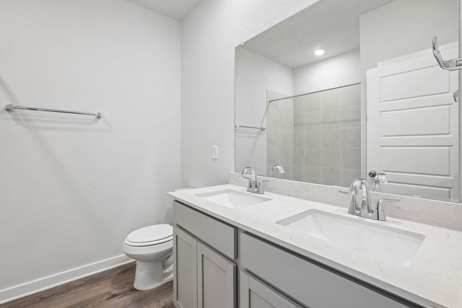 Furnished interior view inside a new home in Stallion Run, Buda (Image 8).