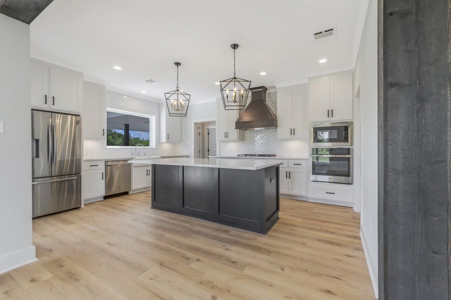 Representative furnished interior of a home built from the The Evangeline by Manuel Builders in Chapel Bend, Montgomery (Image 8). Representative furnished interior of a home built from the The Evangeline by Manuel Builders in Chapel Bend, Montgomery (Image 8).