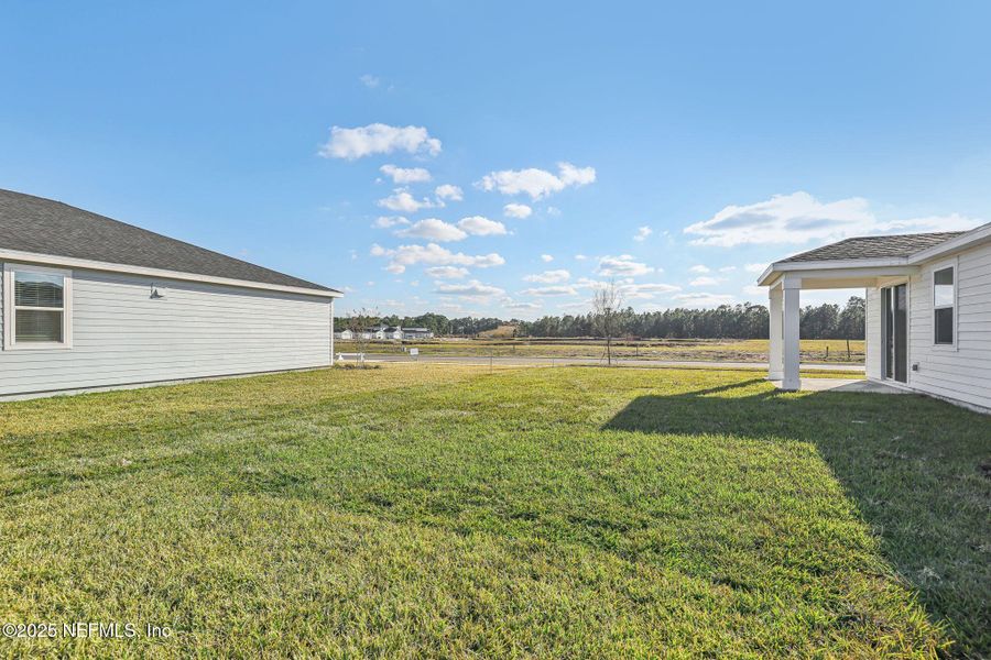Front exterior of a new home in Lakes at Bella Lago - Signature Series, Green Cove Springs, FL, highlighting curb appeal (Image 16). Front exterior of a new home in Lakes at Bella Lago - Signature Series, Green Cove Springs, FL, highlighting curb appeal (Image 16).