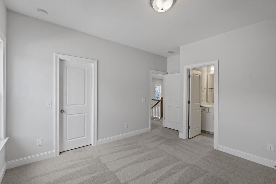 Spacious, unfurnished interior of a new home in K. Hovnanian's® Four Seasons at Lakes of Cane Bay, Summerville (Image 21).