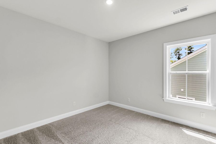 Spacious, unfurnished interior of a new home in Tidewater at Lakes of Cane Bay, Summerville (Image 20).