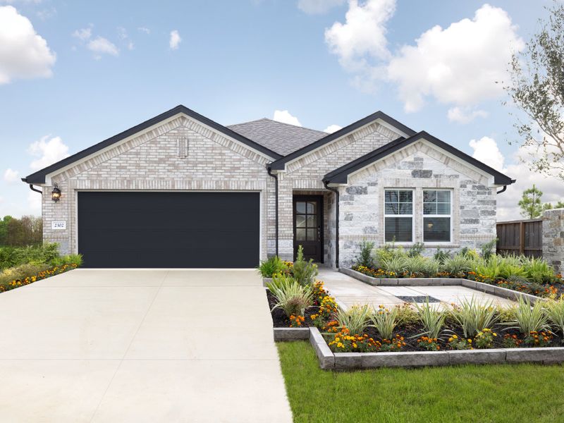 Front exterior of a new home in Southwinds, Baytown, TX, highlighting curb appeal (Image 1).