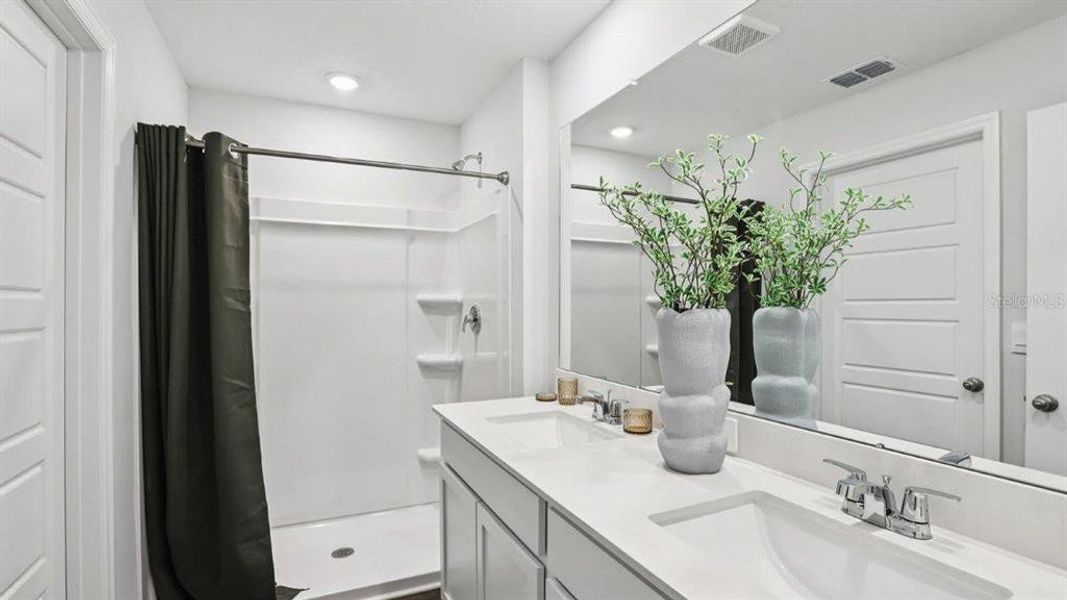 Furnished interior view inside a new home in Lake Deer Estates, Poinciana (Image 22).