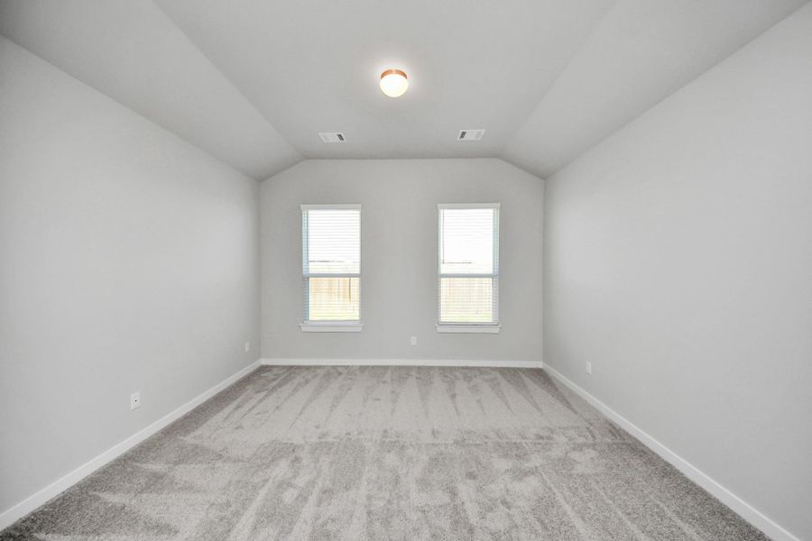 Come and unwind after a long day in this magnificent primary suite! This spacious room features plush carpet, warm paint, high ceilings and large windows with privacy blinds. Come and unwind after a long day in this magnificent primary suite! This spacious room features plush carpet, warm paint, high ceilings and large windows with privacy blinds.