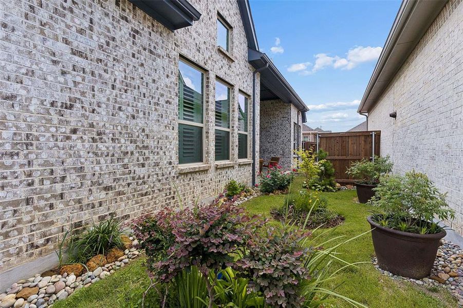 Exterior details and patio area of a home in Elements at Viridian - Garden Series, Arlington (Image 3).