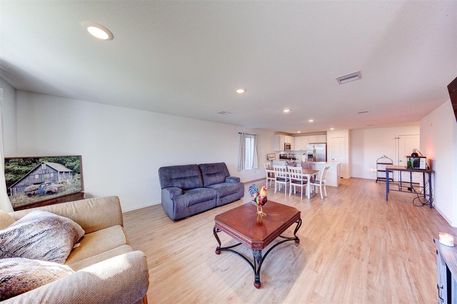 Living room open to the dining and kitchen