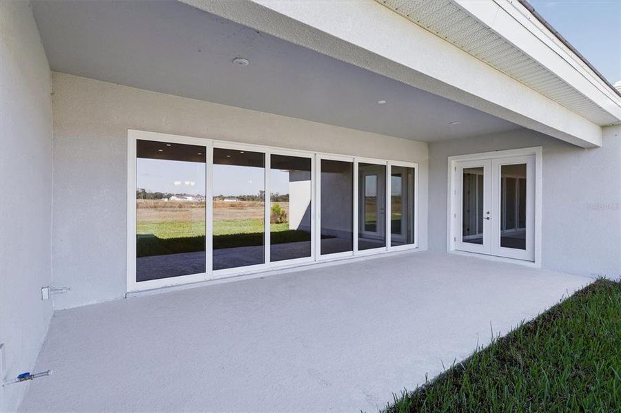 Exterior details and patio area of a home in Oakfield, Parrish (Image 2).