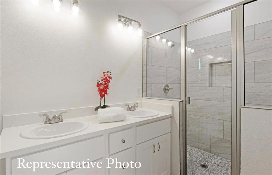 Bathroom with vanity and an enclosed shower