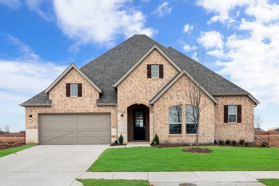 Representative exterior photo of a completed home built from the Cameron by UnionMain Homes in Cambridge Crossing, Celina, TX (Image 19).