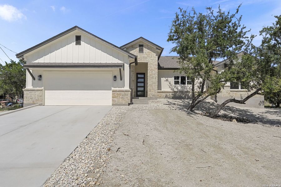 Front exterior of a new home in , Canyon Lake, TX, highlighting curb appeal (Image 25). Front exterior of a new home in , Canyon Lake, TX, highlighting curb appeal (Image 25).
