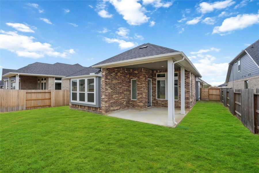 Exterior details and patio area of a home in Sunterra, Katy (Image 16). Exterior details and patio area of a home in Sunterra, Katy (Image 16).