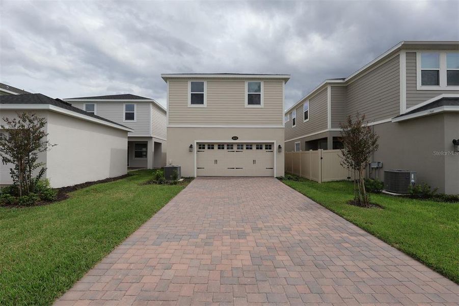Exterior details and patio area of a home in Center Lake on the Park, St. Cloud (Image 2).