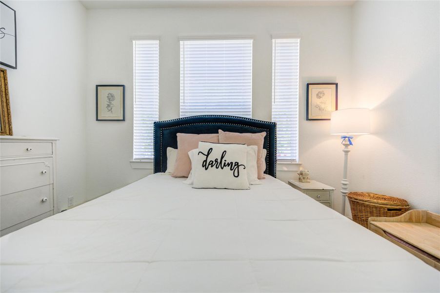 Natural light enhances this inviting bedroom, creating a peaceful place to unwind. Natural light enhances this inviting bedroom, creating a peaceful place to unwind.