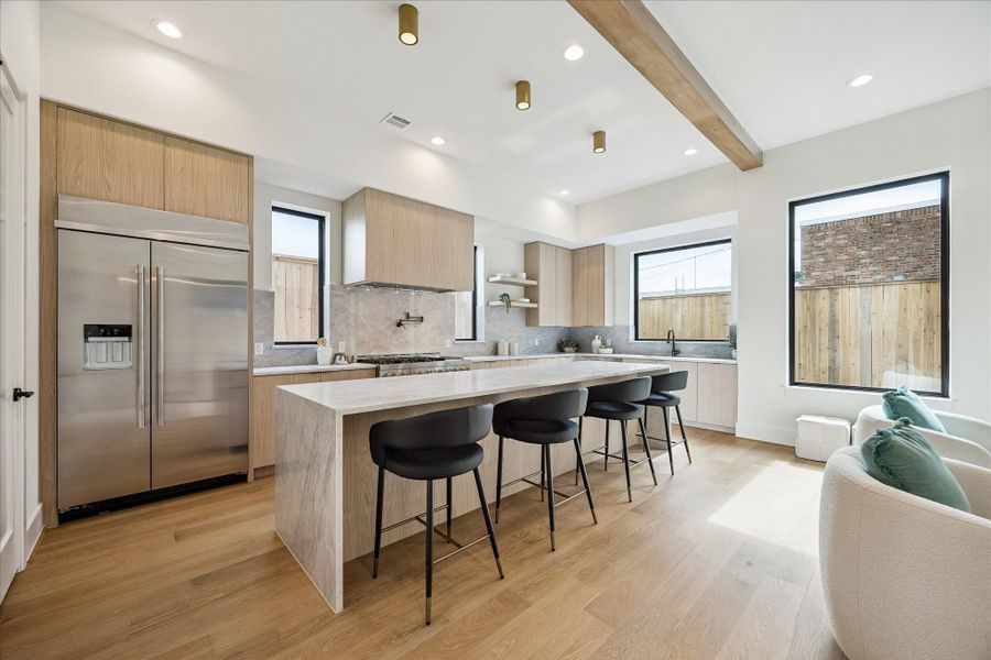 Kitche offers a pantry and designer lighting fixtures. Kitche offers a pantry and designer lighting fixtures.