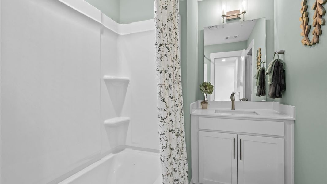 Functional full bathroom enhanced by refined materials and cohesive design located in Moore, SC