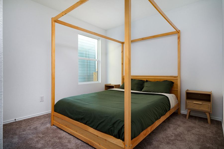 Bedroom featuring carpet and baseboards Bedroom featuring carpet and baseboards