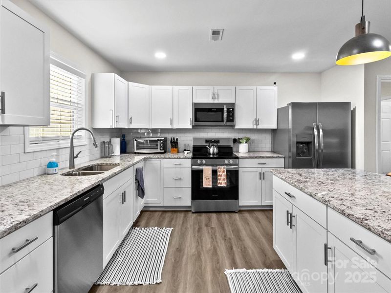 Beautiful Large Kitchen, with Ample Counter space, and ALL appliances convey with the sale