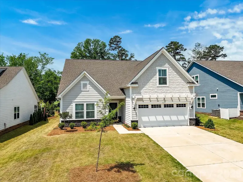 Front exterior of a new home in , Monroe, NC, highlighting curb appeal (Image 21).