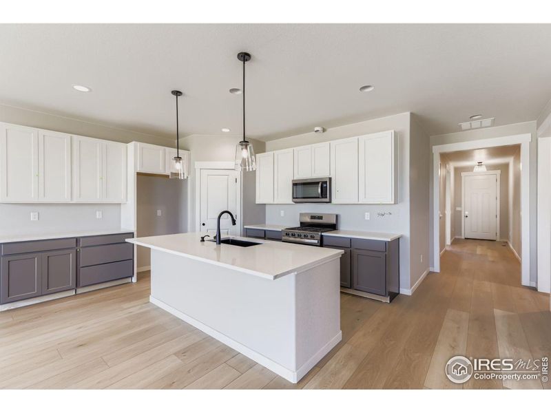 Furnished interior view inside a new home in Barefoot Lakes, Firestone (Image 10).