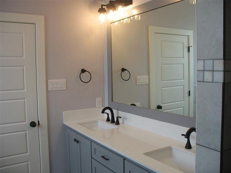 Bathroom featuring double vanity