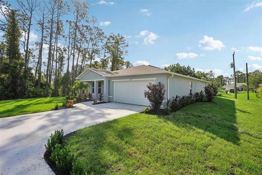 Front exterior of a new home in , Weeki Wachee, FL, highlighting curb appeal (Image 23).