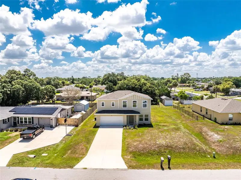 Front exterior of a new home in , Port Charlotte, FL, highlighting curb appeal (Image 27).