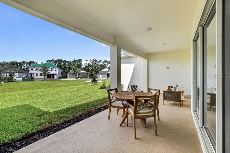 Exterior details and patio area of a home in Ardisia Park, New Smyrna Beach (Image 27).