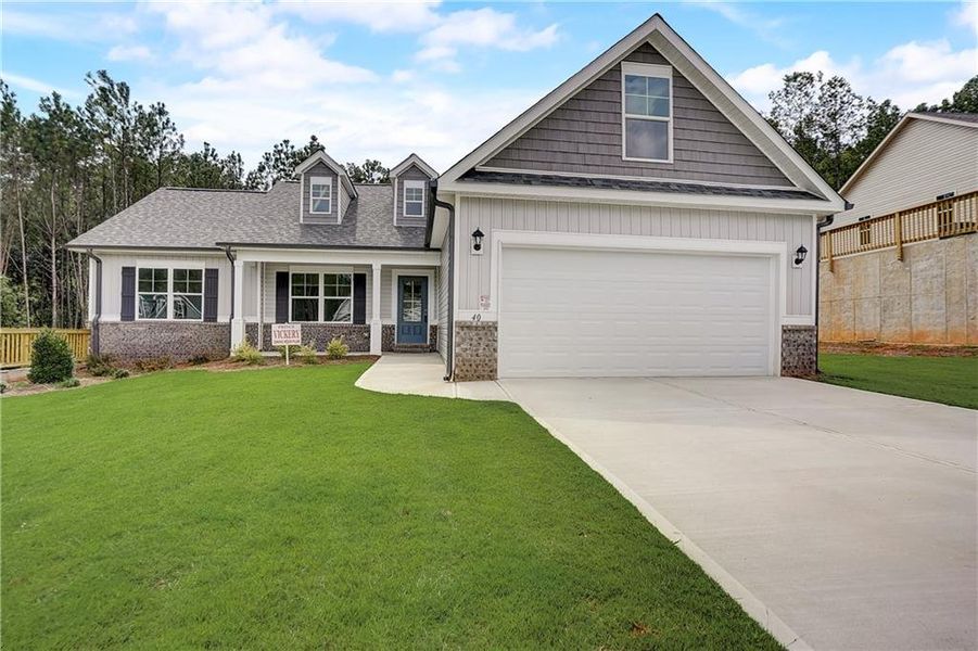 Front exterior of a new home in , Covington, GA, highlighting curb appeal (Image 1). Front exterior of a new home in , Covington, GA, highlighting curb appeal (Image 1).