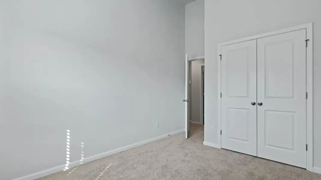 Spacious, unfurnished interior of a new home in Pine Hills Townhomes at Cane Bay, Summerville (Image 17). Spacious, unfurnished interior of a new home in Pine Hills Townhomes at Cane Bay, Summerville (Image 17).
