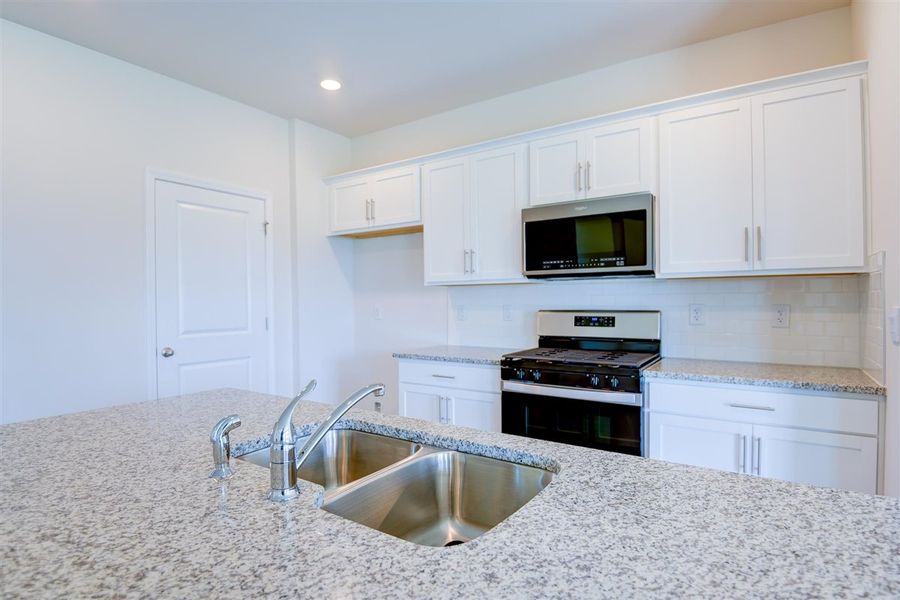 Representative furnished interior of a home built from the ARIA by D.R. Horton in West New Bern, New Bern (Image 7).