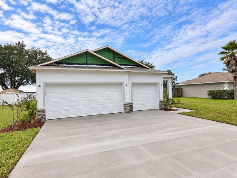 Front exterior of a new home in Palm Coast, Palm Coast, FL, highlighting curb appeal (Image 10).